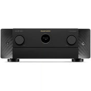 A Marantz AV Receiver 4K Ultra HD in matte black, featuring two large front control knobs, a central round display, and a carbon fiber pattern on the side panels, set against a plain white background.