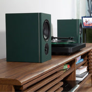 PSB iQ2 BluOS Streaming Powered Speaker in Boreal Green (Pair) Lifestyle - Audiolab